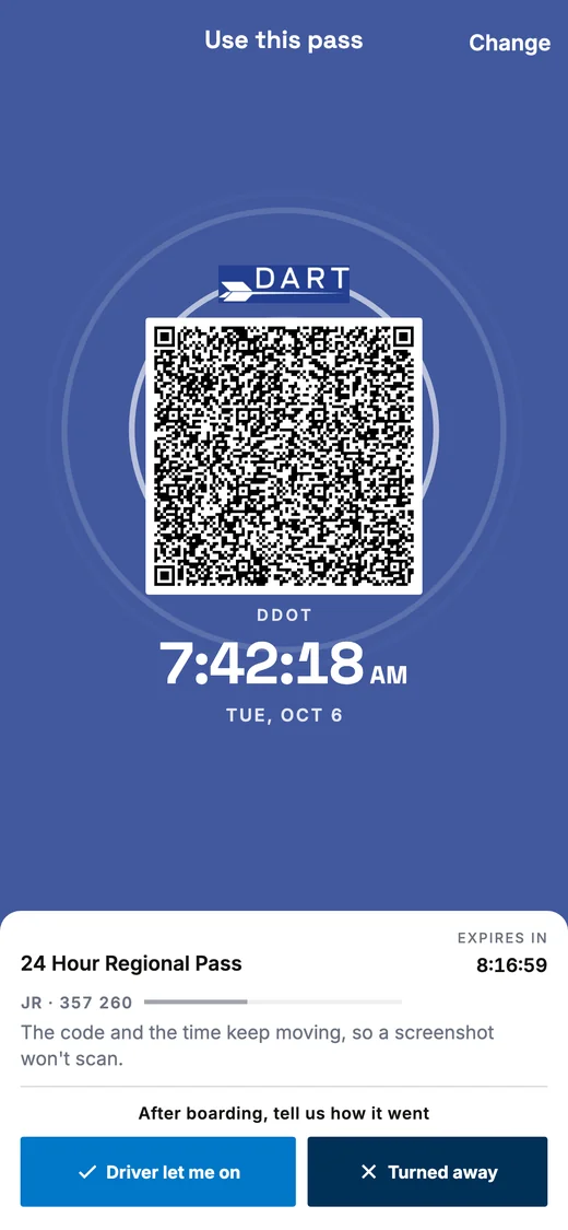 A Regional pass ready to scan: a barcode on a white tile in the middle of the blue screen, with the clock below it