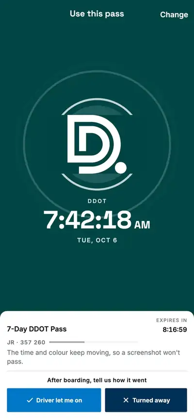 A live DDOT pass: the whole screen in DDOT green, circles leaving the DDOT logo, and the time ticking to the second